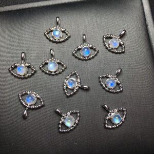 eye shape natural moonstone bead inlaid sterling silver charm