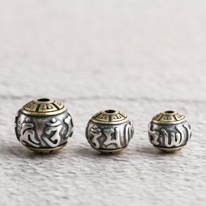 The six-character Buddhist mantra round oxidized sterling silver bead